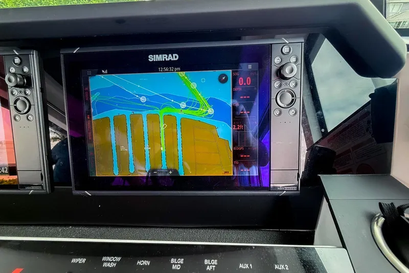 Slide: The Image of Simrad navigation display on 2023 Axopar 37 XC Cross Cabin boat dashboard. - 30