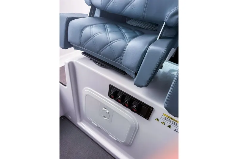 Slide: The Image of 2023 Axopar 37 XC Cross Cabin interior seat and control panel detail. - 34