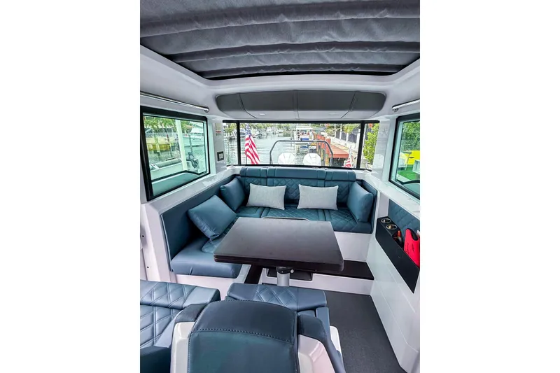 Slide: The Image of Luxurious interior of 2023 Axopar 37 XC Cross Cabin with plush seating and modern design. - 42