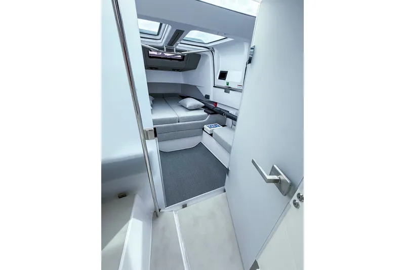 Slide: The Image of Interior view of 2023 Axopar 37 XC Cross Cabin, featuring modern seating and skylights. - 47