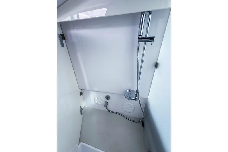 Slide: The Image of Shower area in 2023 Axopar 37 XC Cross Cabin boat, featuring modern fixtures. - 52