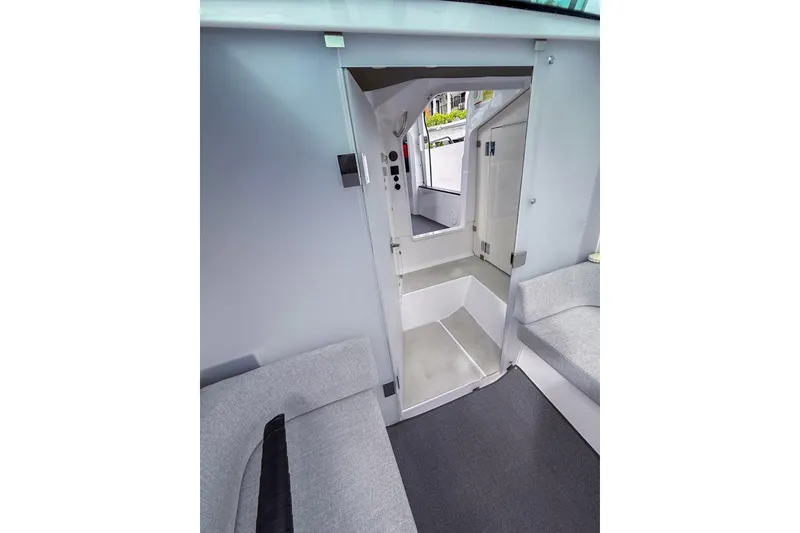 Slide: The Image of Interior of 2023 Axopar 37 XC Cross Cabin, featuring modern seating and sleek design. - 53