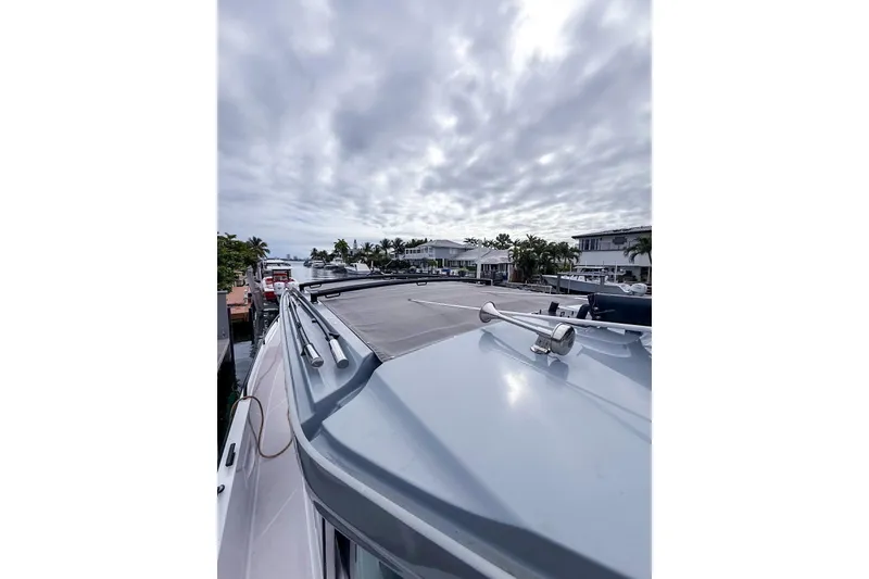 Slide: The Image of 2023 Axopar 37 XC Cross Cabin boat docked under cloudy sky. - 55