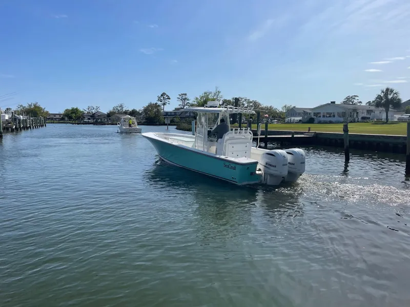 Slide: The Image of SeaCraft 32 boat with Yamaha F300 engines on calm water. - 10