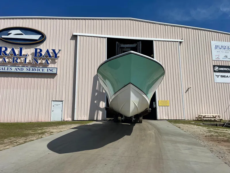 Slide: The Image of SeaCraft 32 boat outside a marina building, year 2007. - 4