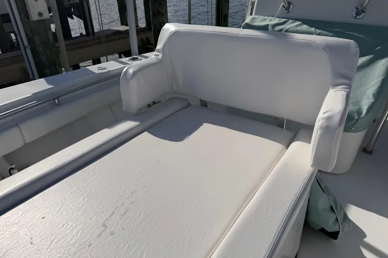 Slide: The Image of White seating on 2007 SeaCraft SC 32 Master Angler boat, docked by water. - 47