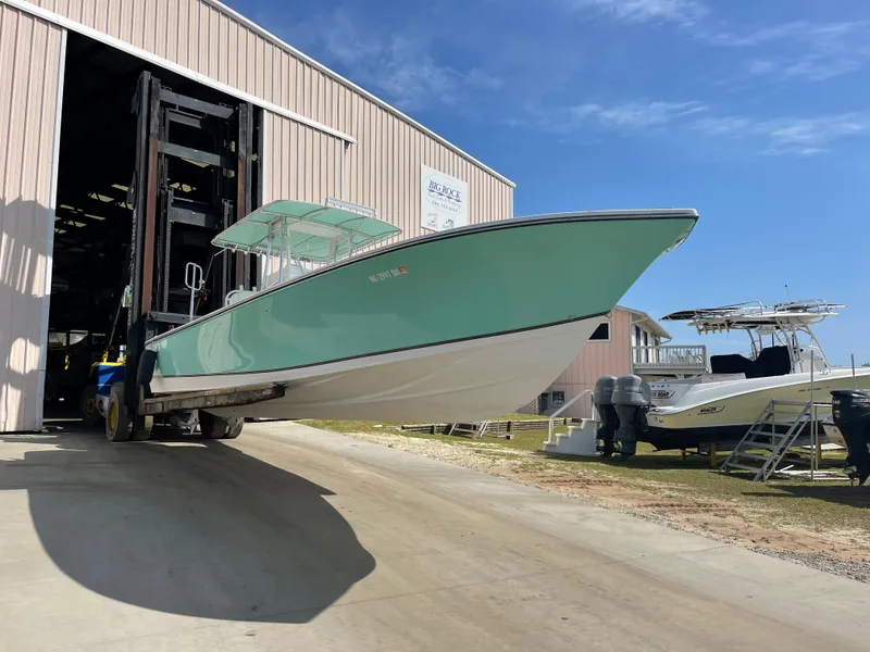 Slide: The Image of SeaCraft 32 boat with Yamaha F300 engines, 2007 model, outside storage facility. - 5