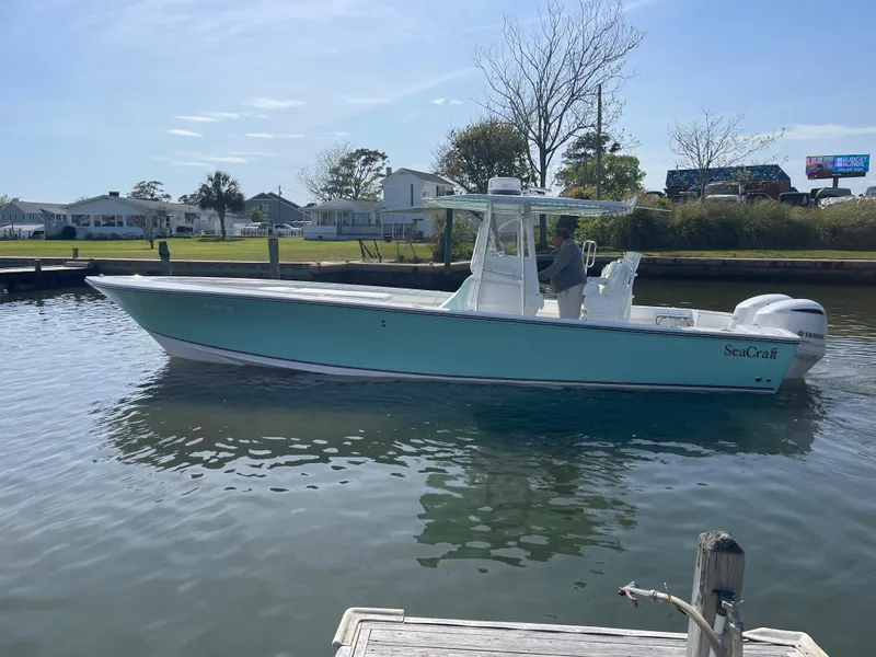 Slide: The Image of 2007 SeaCraft 32 boat on calm water, side view. - 8