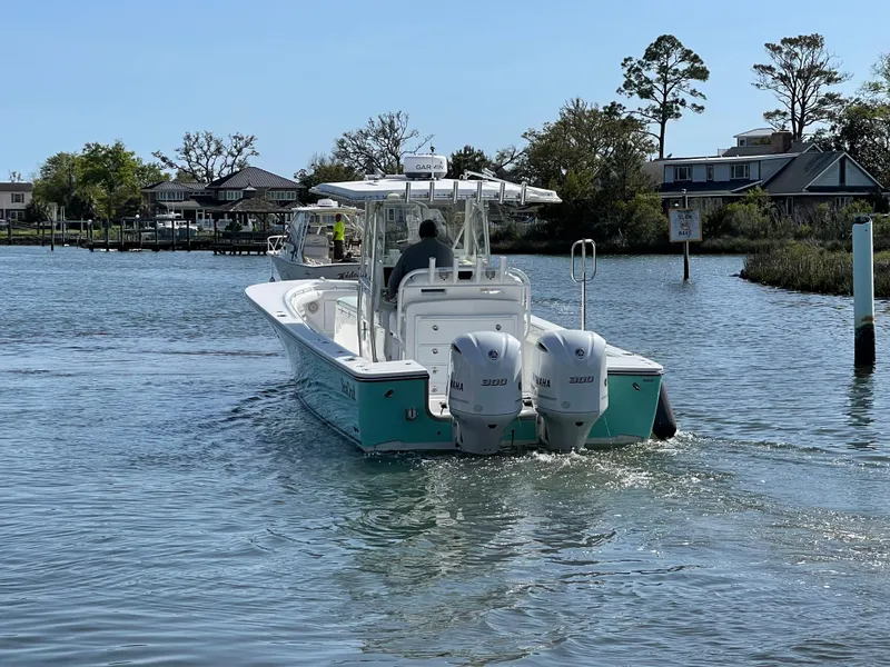 Slide: The Image of SeaCraft 32 boat with Yamaha F300 engines on calm water. - 9