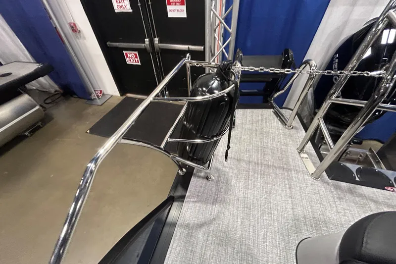 Slide: The Image of 2026 Harris Grand Mariner 250 boat interior with chrome railing and safety features. - 13