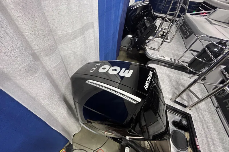 Slide: The Image of 2026 Harris Grand Mariner 250 with Mercury outboard motor at a boat show. - 14