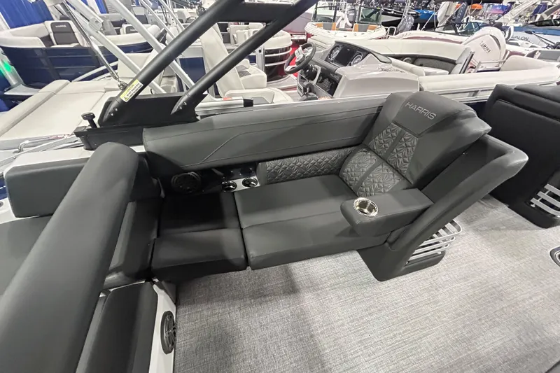 Slide: The Image of Luxurious seating on 2026 Harris Grand Mariner 250 pontoon boat with cup holder and sleek design. - 17