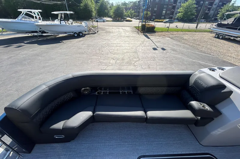 Slide: The Image of 2026 Harris Grand Mariner 250 pontoon boat with sleek black seating and modern design. - 20