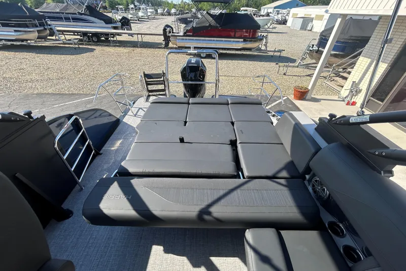 Slide: The Image of 2026 Harris Grand Mariner 250 pontoon boat with spacious seating and modern design. - 23