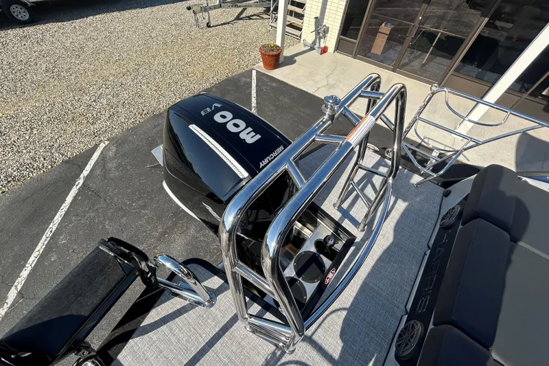 Slide: The Image of 2026 Harris Grand Mariner 250 boat with Mercury 400 engine, docked on pavement. - 24