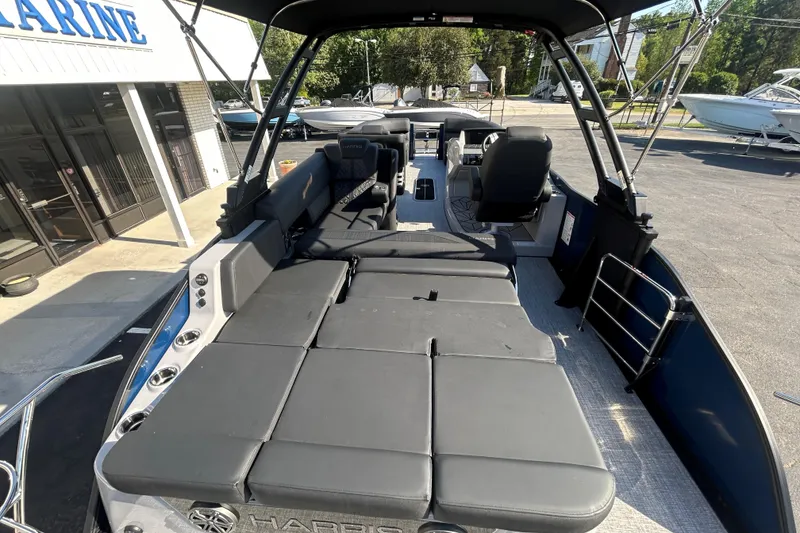Slide: The Image of 2026 Harris Grand Mariner 250 pontoon boat interior with spacious seating and modern design. - 25