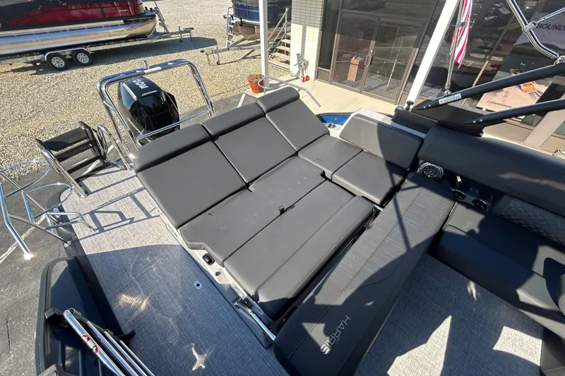 Slide: The Image of 2026 Harris Grand Mariner 250 boat with spacious seating and modern design. - 26