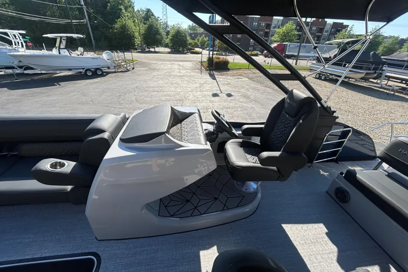 Slide: The Image of 2026 Harris Grand Mariner 250 boat interior with luxurious seating and modern helm design. - 28