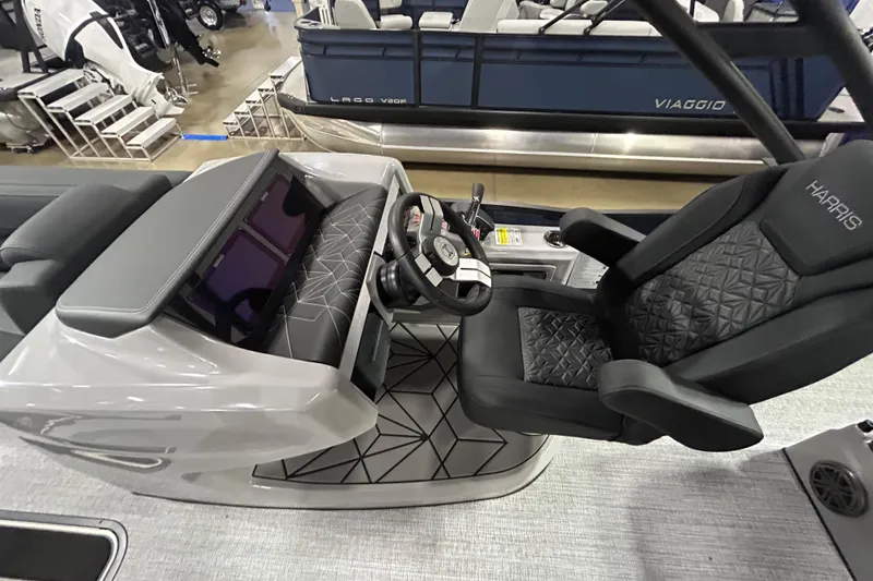 Slide: The Image of 2026 Harris Grand Mariner 250 helm with modern steering and seating design. - 3