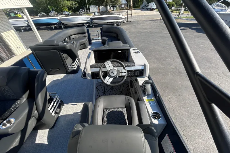 Slide: The Image of 2026 Harris Grand Mariner 250 boat interior with modern steering and seating. - 30