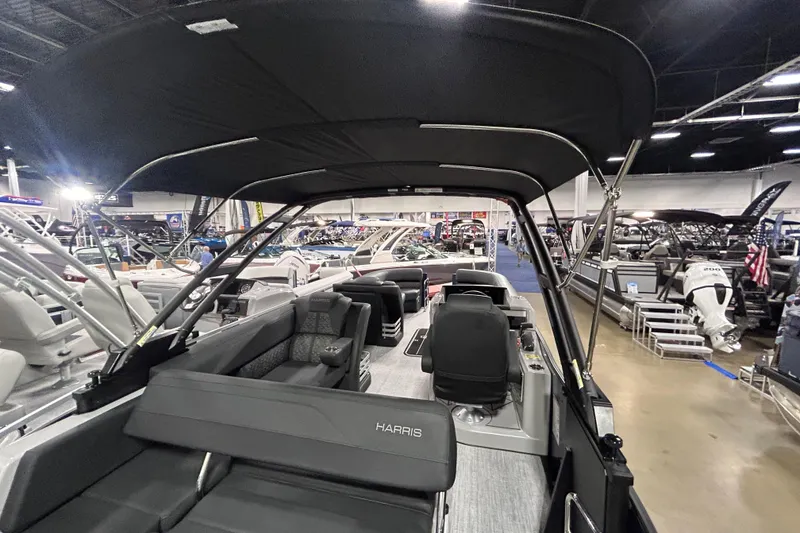 Slide: The Image of 2026 Harris Grand Mariner 250 pontoon boat interior at a boat show. - 7