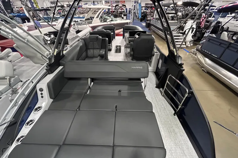 Slide: The Image of 2026 Harris Grand Mariner 250 luxury pontoon boat interior at a showroom display. - 8