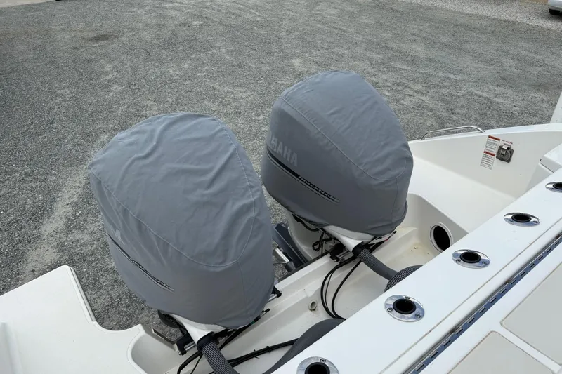 Slide: The Image of 2021 Pursuit S 328 Sport boat with covered Yamaha outboard engines. - 10