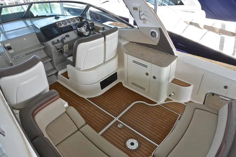 Slide: The Image of 2016 Sea Ray Sundancer 370 cockpit with luxurious seating and modern helm controls. - 13