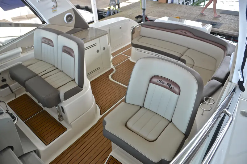 Slide: The Image of 2016 Sea Ray Sundancer 370 interior with luxurious seating and teak flooring. - 14