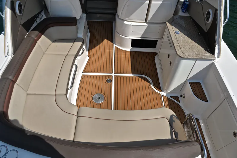 Slide: The Image of 2016 Sea Ray Sundancer 370 cockpit with cushioned seating and teak flooring. - 18