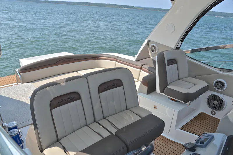 Slide: The Image of 2016 Sea Ray Sundancer 370 interior with luxurious seating and scenic ocean view. - 24