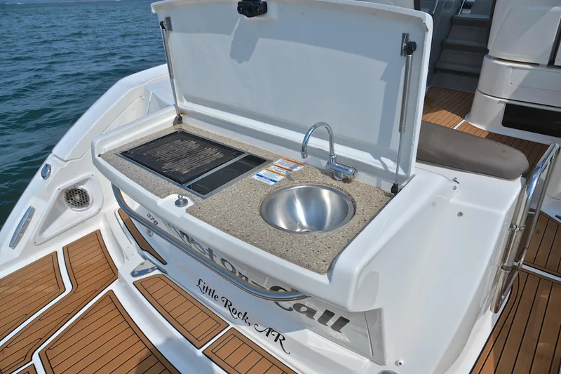 Slide: The Image of Outdoor kitchenette on 2016 Sea Ray Sundancer 370 yacht with sink and grill. - 26