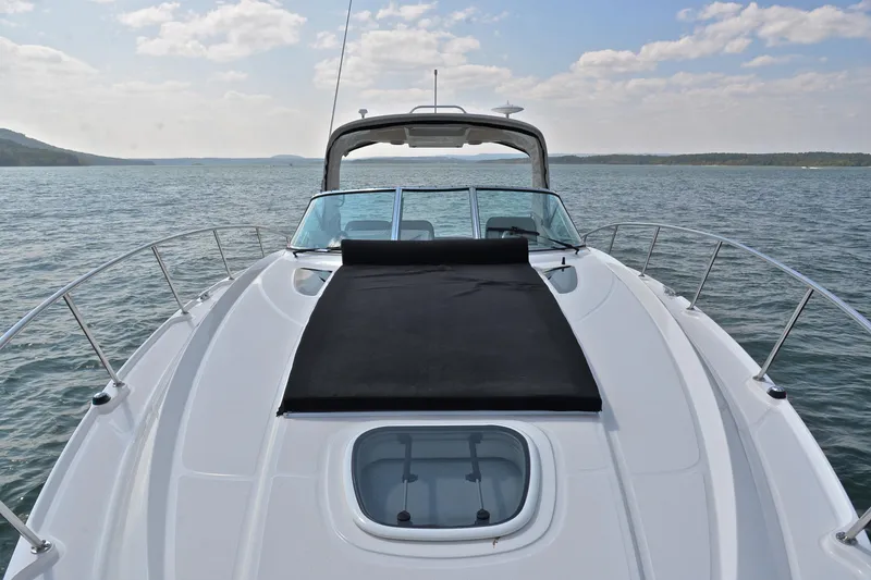 Slide: The Image of 2016 Sea Ray Sundancer 370 yacht on open water, showcasing sleek deck design. - 29