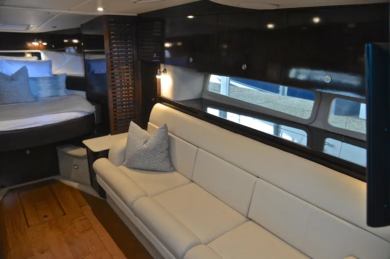 Slide: The Image of Luxurious interior of 2016 Sea Ray Sundancer 370 yacht with elegant seating and bedding. - 31