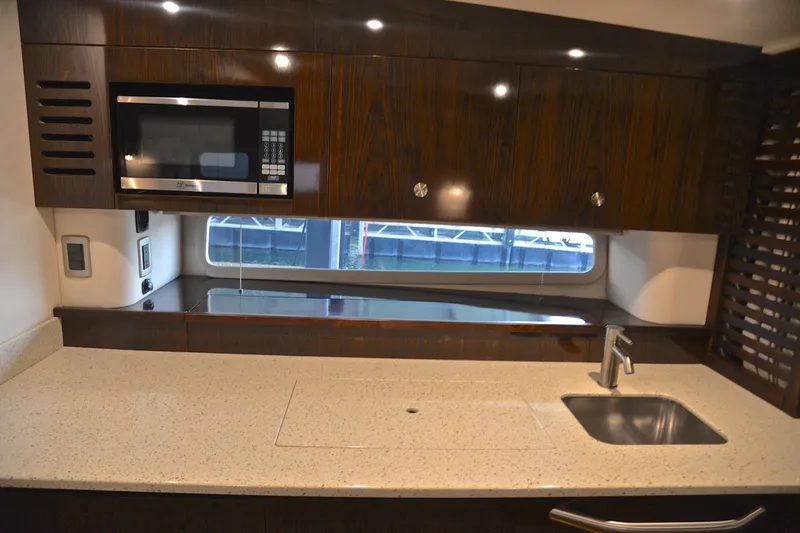 Slide: The Image of Luxurious 2016 Sea Ray Sundancer 370 yacht kitchen with modern amenities and sleek design. - 35