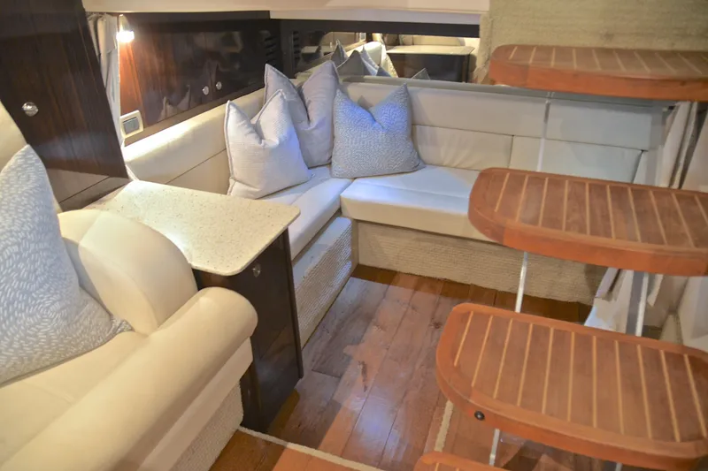 Slide: The Image of Luxurious interior of 2016 Sea Ray Sundancer 370 with cozy seating and elegant wooden steps. - 38