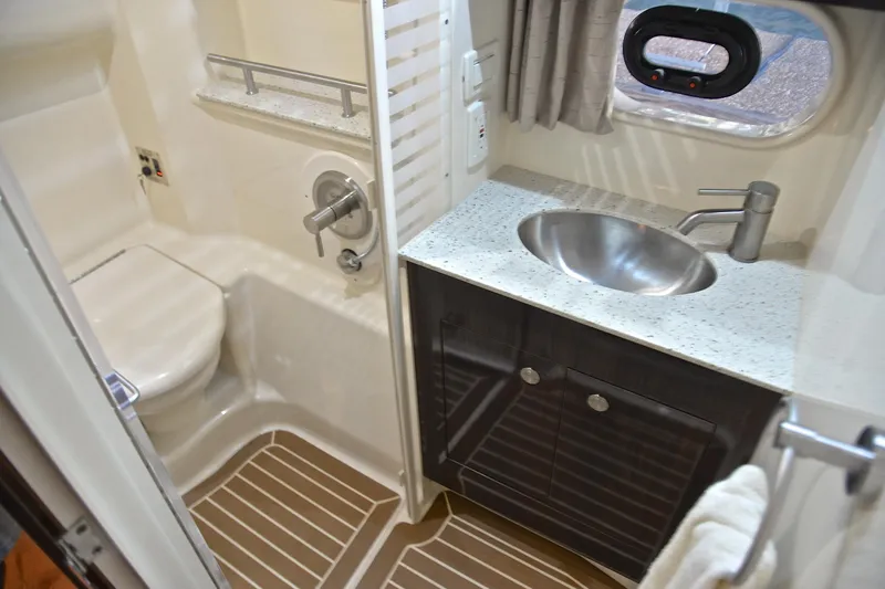 Slide: The Image of Bathroom interior of 2016 Sea Ray Sundancer 370 yacht with modern fixtures and wood flooring. - 40
