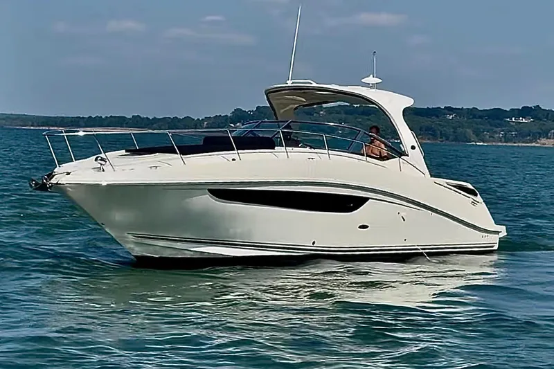 Slide: The Image of 2016 Sea Ray Sundancer 370 yacht cruising on open water. - 5