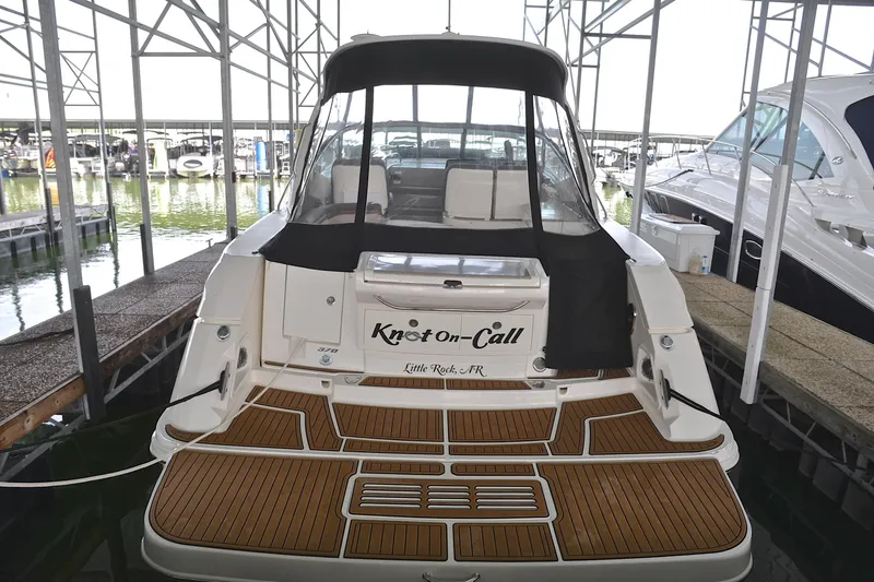 Slide: The Image of 2016 Sea Ray Sundancer 370 docked, featuring teak swim platform and covered cockpit. - 7