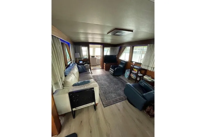 Slide: The Image of Interior of 1978 Hatteras 53 Motor Yacht with cozy seating and elegant decor. - 38