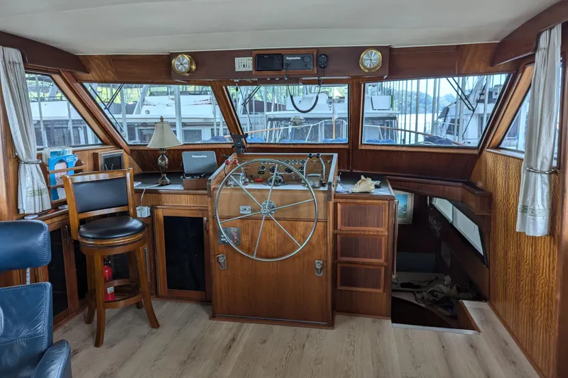 Slide: The Image of 1978 Hatteras 53 Motor Yacht helm with wooden interior and navigation equipment. - 39