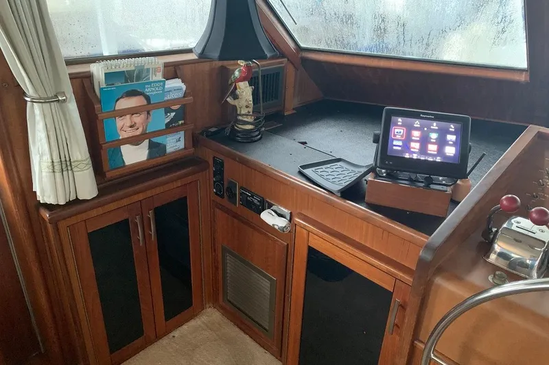 Slide: The Image of Interior helm of 1978 Hatteras 53 Motor Yacht with navigation equipment and wood cabinetry. - 41