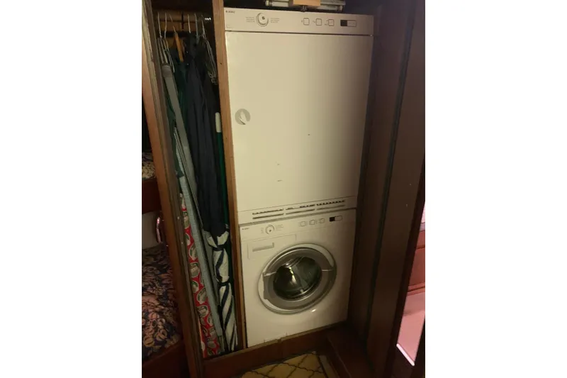 Slide: The Image of Stacked washer and dryer in 1978 Hatteras 53 Motor Yacht interior. - 49