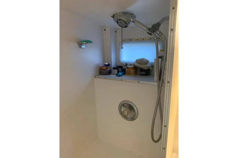 Slide: The Image of 1978 Hatteras 53 Motor Yacht bathroom with shower and sink. - 60