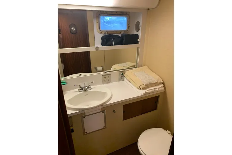 Slide: The Image of Shower area in 1978 Hatteras 53 Motor Yacht with toiletries and showerhead. - 61