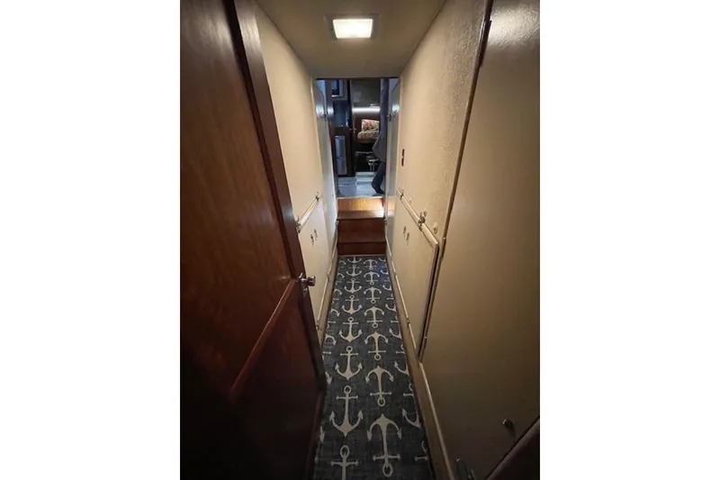 Slide: The Image of Bathroom interior of 1978 Hatteras 53 Motor Yacht with sink, mirror, and towels. - 62