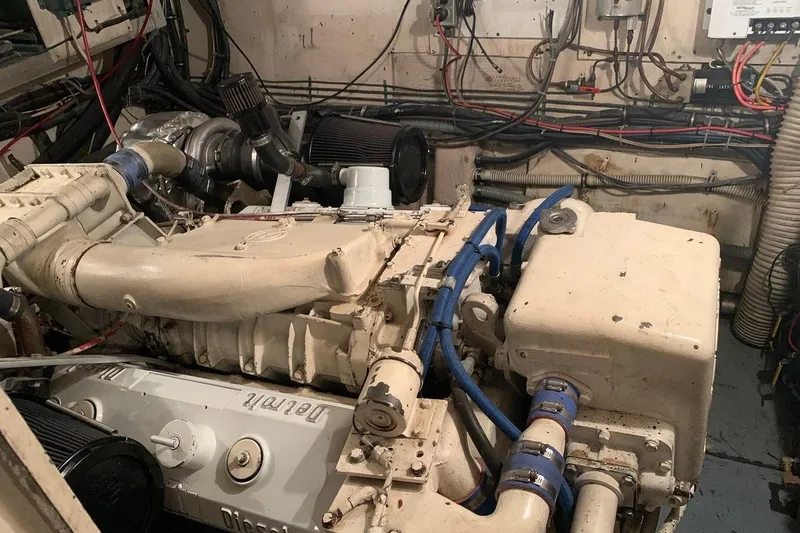 Slide: The Image of Engine room of a 1978 Hatteras 53 Motor Yacht with visible machinery and wiring. - 66