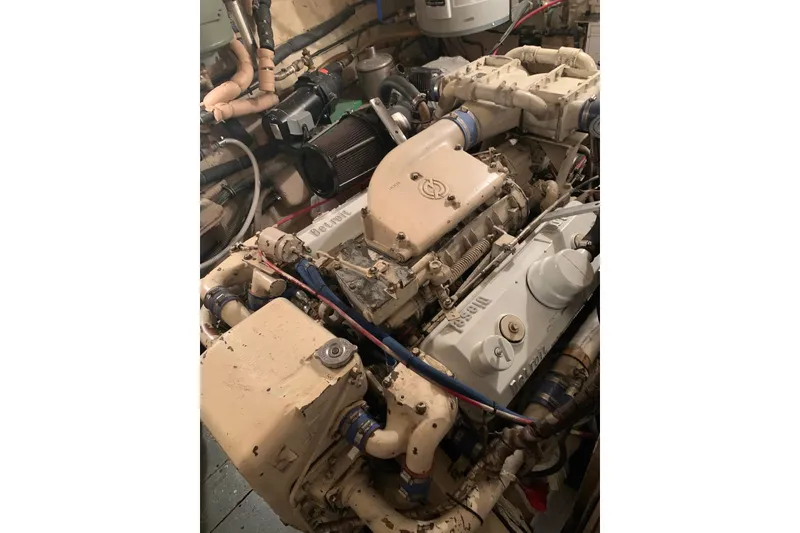 Slide: The Image of Engine room of a 1978 Hatteras 53 Motor Yacht with visible machinery and wiring. - 71