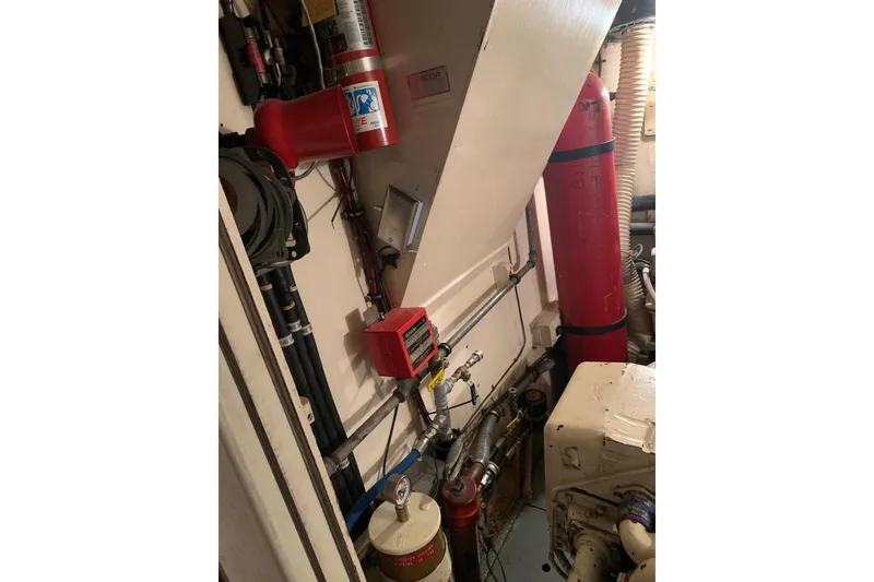 Slide: The Image of Engine room of a 1978 Hatteras 53 Motor Yacht, showcasing mechanical components. - 72