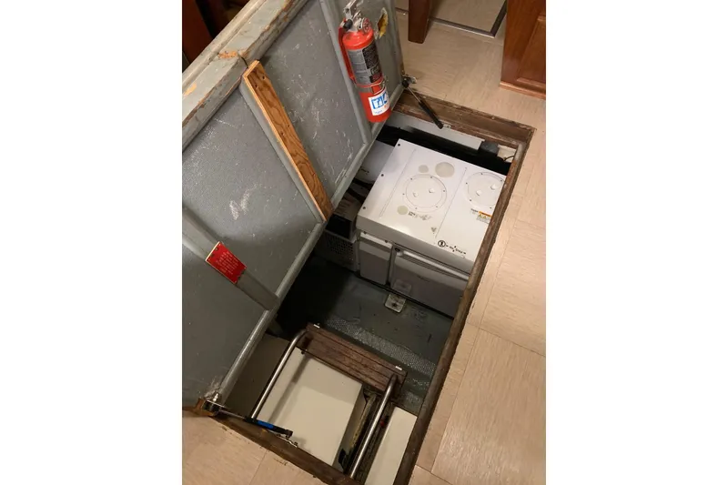 Slide: The Image of Engine room of a 1978 Hatteras 53 Motor Yacht with fire safety equipment. - 73